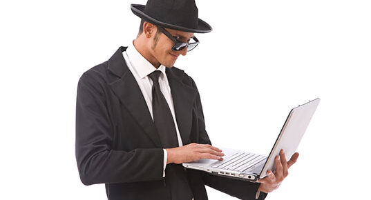 funny looking computer hacker with a laptop