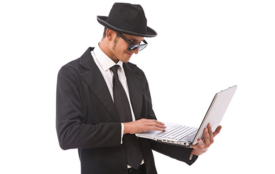 funny looking computer hacker with a laptop