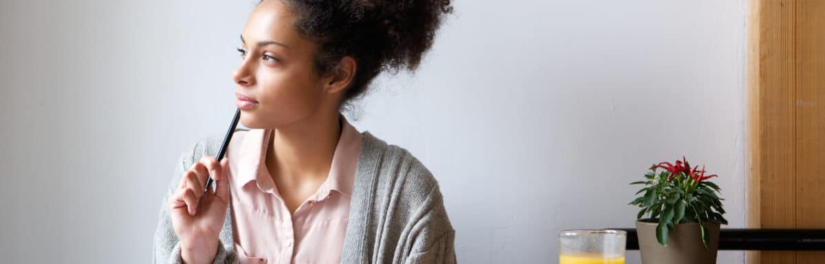 woman thinking of editorial calendar