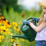 girl watering flowers