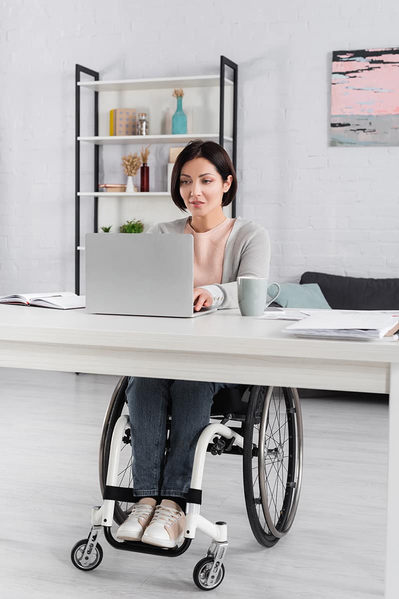 woman in wheelchair using ADA compliant website