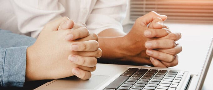 family praying worship online together