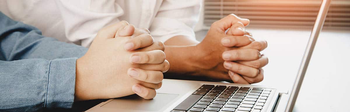 family praying worship online together