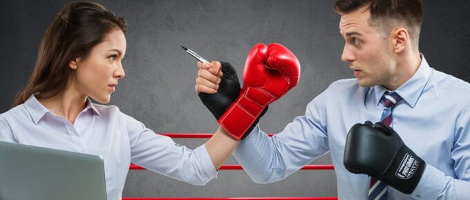 woman and man representing marketing vs sales are sparring in the boxing ring