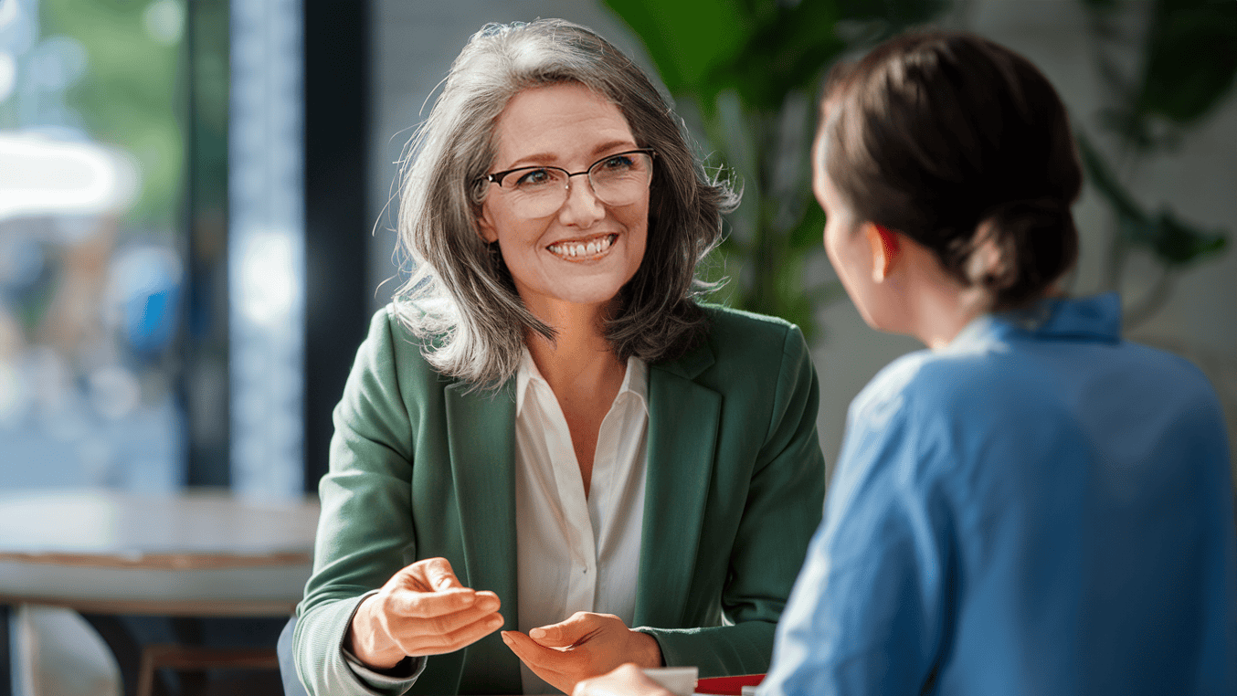 High-impact strategy session with Kathryn: Kathryn chats with a client in a coffee shop